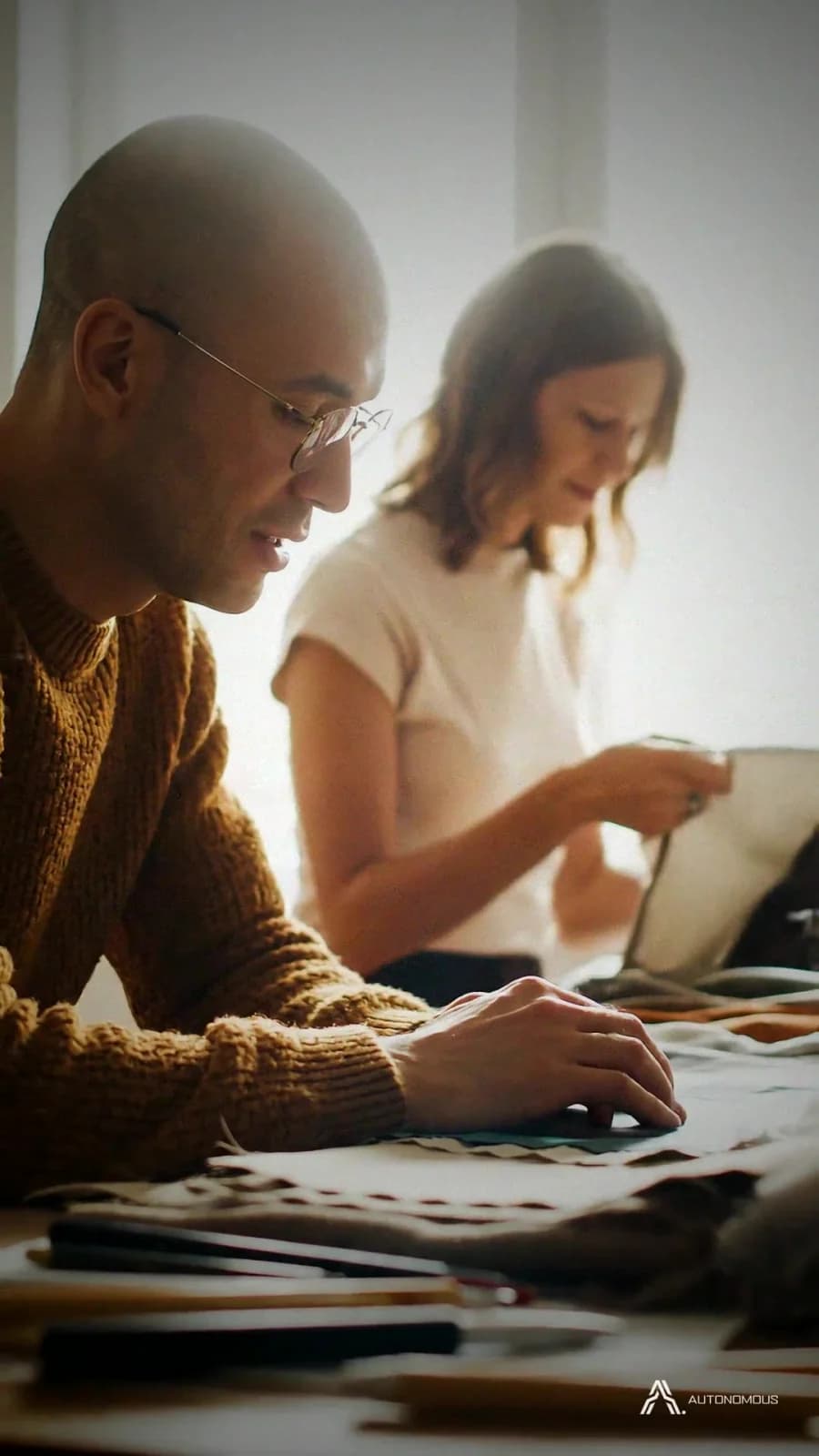 Two commerce makers working together at a garment table